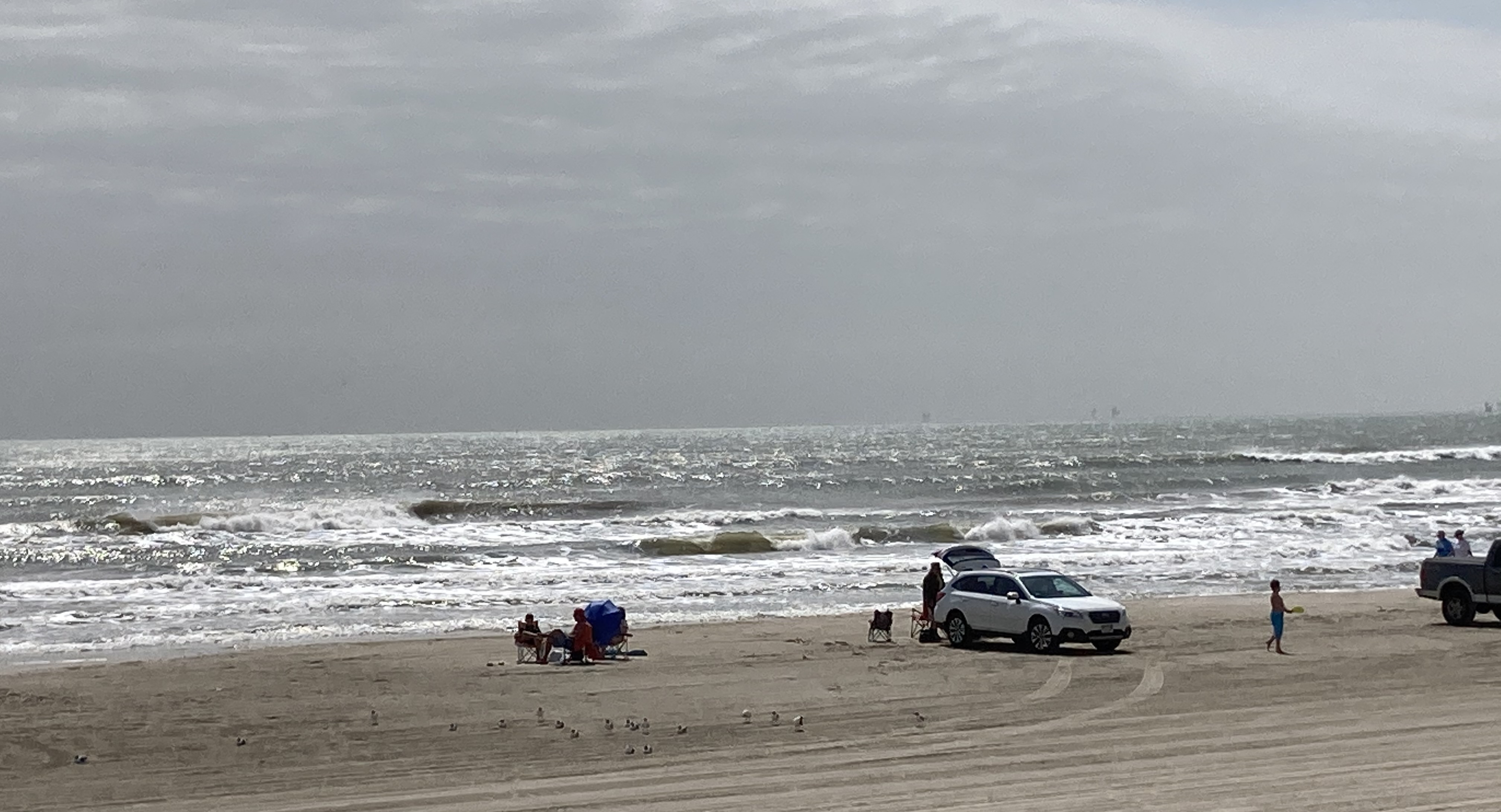 Families enjoying a sunny day at the beach